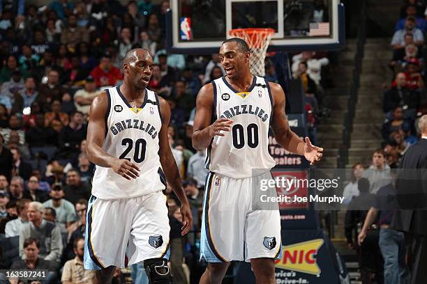Quincy Pondexter and Darrell Arthur of the Memphis Grizzlies share a word during a break in play against the Dallas Mavericks on February 27, 2013 at...