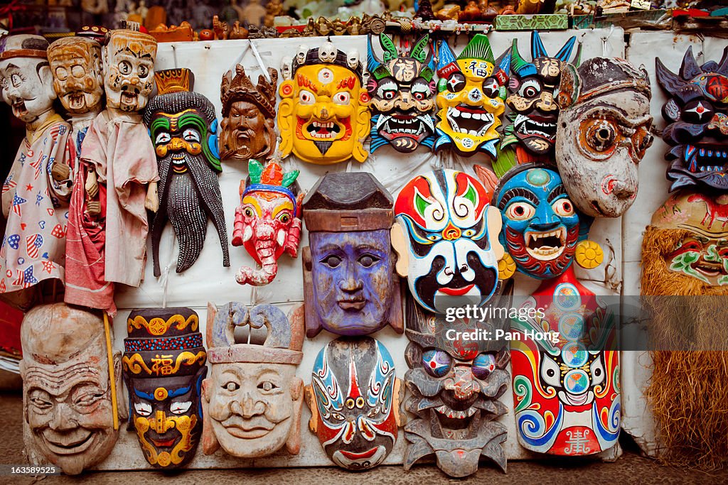 Mask dolls for sale at street stall