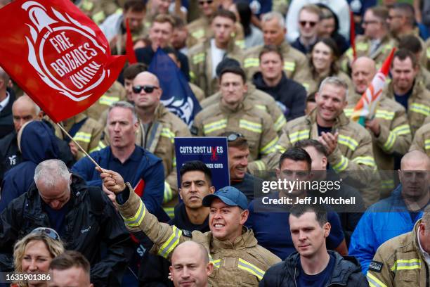 Fire fighters gather during a Fire Brigades Union’s demonstration in Glasgow’s George Square on August 24, 2023 in Glasgow, Scotland. The rally is...