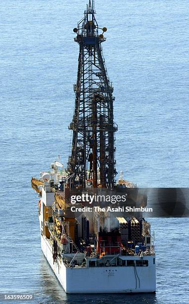 In this aerial image, the first ever methane hydrate gas taken from seabed layers is seen lit at the stern of drilling vessel Chikyu, as Japan Oil,...