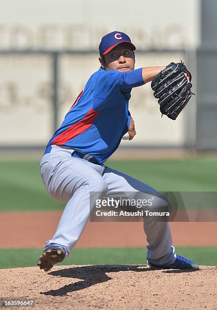Pitcher Hisanori Takahashi of Chicago Cubs throws during a spring training game against Texas Rangers on March 6, 2013 in Surprize, Arizona.