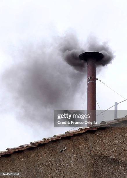 Black smoke billows from the chimney on the roof of the Sistine Chapel indicating that the College of Cardinals have failed to elect a new Pope on...