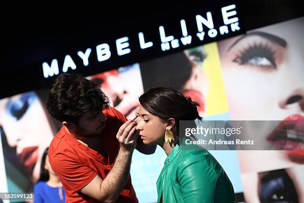 Fashion Blogger Buse Terim gets her make-up done at the Maybelline booth during Mercedes-Benz Fashion Week Istanbul Fall/Winter 2013/14 at Antrepo 3...
