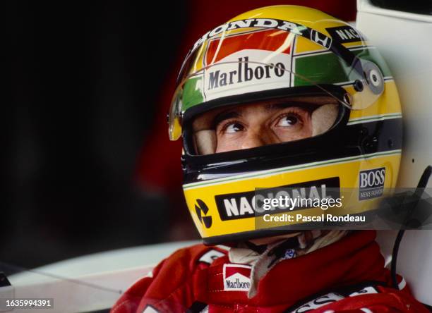 Ayrton Senna from Brazil looks out from the cockpit of the Honda Marlboro McLaren McLaren MP4/5 Honda V10 during practice for the Formula One Fuji...