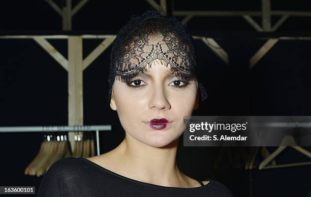 Model prepares backstage ahead of the Janucha By Jale Hurdogan show during Mercedes-Benz Fashion Week Istanbul Fall/Winter 2013/14 at Antrepo 3 on...