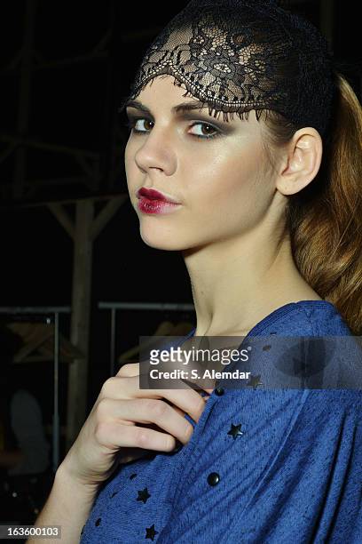 Model prepares backstage ahead of the Janucha By Jale Hurdogan show during Mercedes-Benz Fashion Week Istanbul Fall/Winter 2013/14 at Antrepo 3 on...