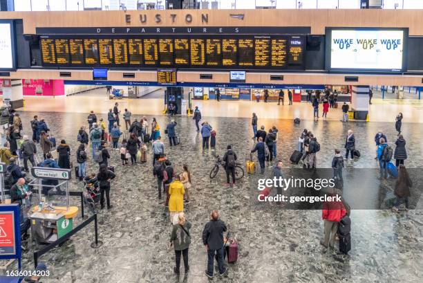 passengers at euston train station - london train stock pictures, royalty-free photos & images