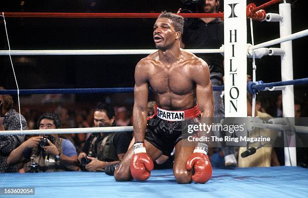 Alfonzo Ratliff sits on the canvas after being knocked down by Mike Tyson during the fight at the Hilton Hotel in Las Vegas, Nevada. Mike Tyson won...