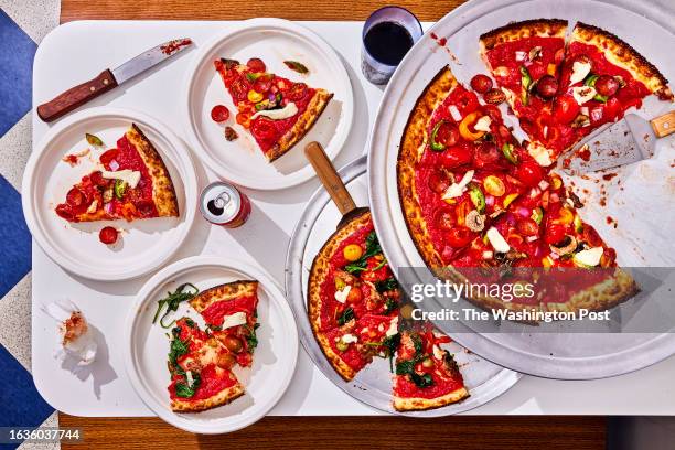 Custom pizza topped with pepperoni, jalapeno peppers, ricotta, mushrooms, kumato tomatoes and Custom pizza topped with ricotta, spinach, kumato...