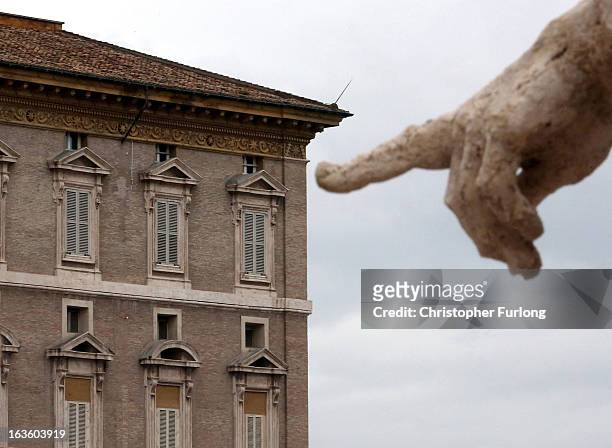 Vatican statue overlooks the private papal apartments which are sealed and locked as they wait for the next pope on March 13, 2013 in Vatican City,...