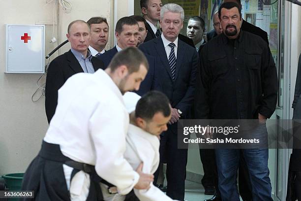 Actor Steven Seagal and Russian President Vladimir Putin visit Sambo-70, a Russian martial art and combat sport school, March 13, 2013 in Moscow,...