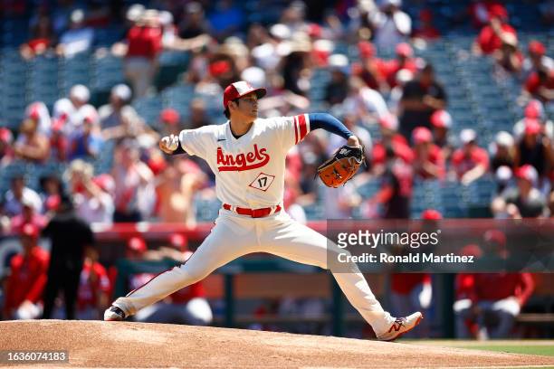 Shohei Ohtani of the Los Angeles Angels throws against the Cincinnati Reds in the first inning during game one of a doubleheader at Angel Stadium of...