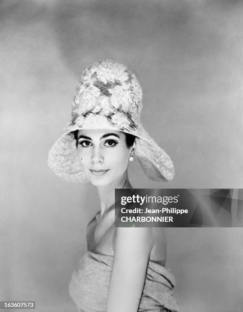 Model presenting a hat designed by French fashion designer Pierre Cardin, in May 1961 in Paris, France.