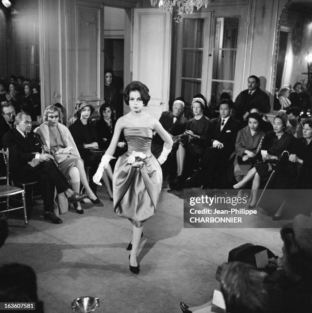Model presenting a dress at a Pierre Cardin fashion show, in 1958 in Paris, France.