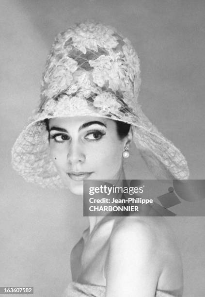 Model presenting a hat designed by French fashion designer Pierre Cardin, in May 1961 in Paris, France.