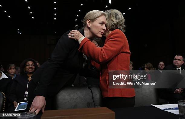 Sen. Kirsten Gillibrand confers with U.S. Sen. Barbara Boxer before a hearing on sexual assaults in the miitary March 13, 2013 in Washington, DC. The...