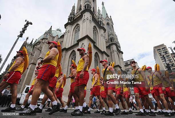 Brazilian lifeguards march past Se Cathedral, the cathedral of the Roman Catholic Archbishop of Sao Paulo, Cardinal Odilo Pedro Scherer, during a...