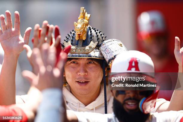 Ippei Mizuhara, interpreter for Shohei Ohtani of the Los Angeles Angels in the first inning during game one of a doubleheader at Angel Stadium of...
