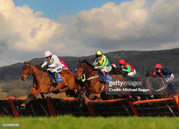 Ruby Walsh on Pont Alexandre leads Jamie Moore on Ubak in the Neptune Investment Management Novices' Hurdle during Ladies Day at Cheltenham...