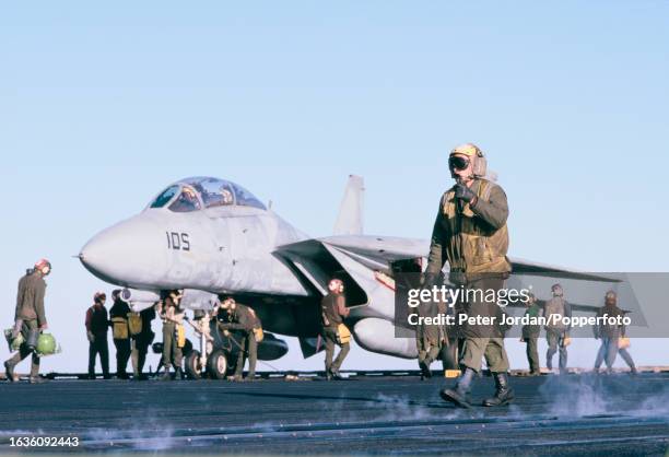 Grumman F-14 Tomcat fighter aircraft from the Carrier air wing lands safely on the flight deck of the United States Navy Forrestal-class aircraft...