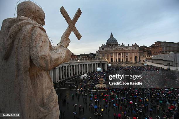 People gather in St Peter's Square as they wait for news on the election of a new Pope on March 13, 2013 in Vatican City, Vatican. Pope Benedict...