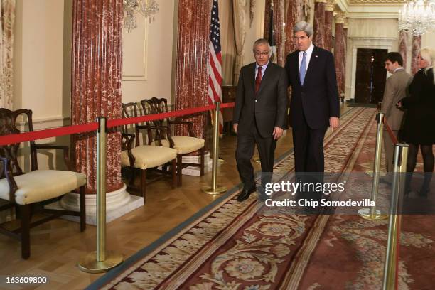 Secretary of State John Kerry and Libyan Prime Minister Ali Zeidan leave after a news conference during bilateral meetings at the State Department on...