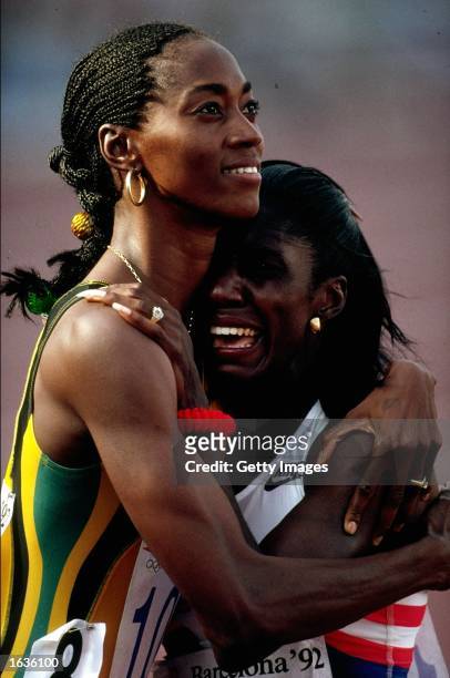 Gwen Torrence of the USA is congratulated by Grace Jackson of Jamaica after winning the 200m during the 1992 Olympic Games held in Barcelona, Spain....