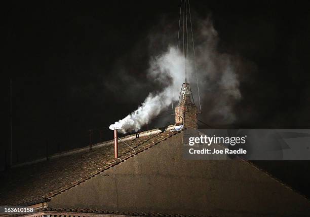 White smoke emits from the chimney on the Sistine Chapel as a new Pope is elected on March 13, 2013 in Vatican City, Vatican. Pope Benedict XVI's...