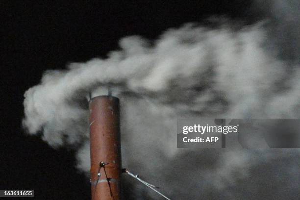 White smoke rises from the chimney on the roof of the Sistine Chapel meaning that cardinals elected a new pope on the second day of their secret...