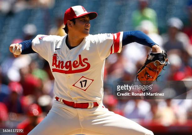 Shohei Ohtani of the Los Angeles Angels throws against the Cincinnati Reds in the second inning during game one of a doubleheader at Angel Stadium of...