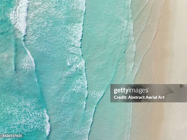 waves from the southern ocean washing onto a beach shot from a drone perspective, esperance, western australia, australia - turquoise colored stock pictures, royalty-free photos & images