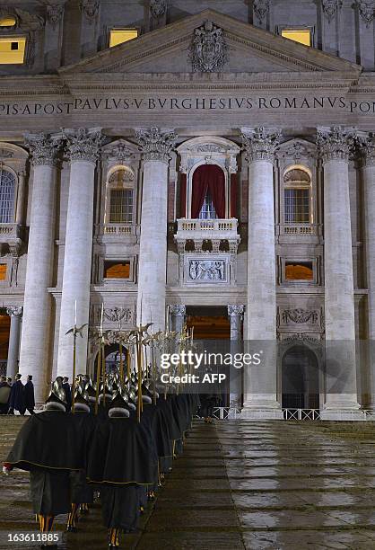 Swiss guard take place before the first appearance of the new pope on the central balcony of St Peter's basilica minutes after white smoke rose from...