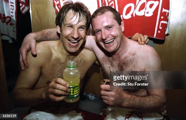 Paul Gascoigne and Paul Merson of Middlesbrough celebrate a return to top flight football after a Nationwide Division One match against Oxford United...