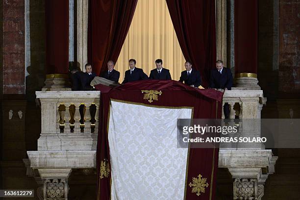 Assistants prepare the balcony prior the arrival of the elected cardinal, Argentinian cardinal Jorge Mario Bergoglio elected Pope Francis I on March...