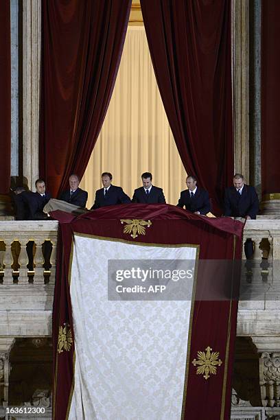 Assistants prepare the balcony prior the arrival of the elected cardinal, Argentinian cardinal Jorge Mario Bergoglio elected Pope Francis I on March...