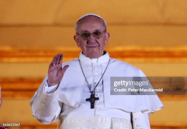 Newly elected Pope Francis I appears on the central balcony of St Peter's Basilica on March 13, 2013 in Vatican City, Vatican. Argentinian Cardinal...