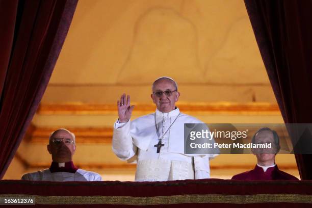 Newly elected Pope Francis I appears on the central balcony of St Peter's Basilica on March 13, 2013 in Vatican City, Vatican. Argentinian Cardinal...