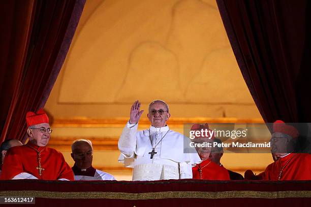 Newly elected Pope Francis I appears on the central balcony of St Peter's Basilica on March 13, 2013 in Vatican City, Vatican. Argentinian Cardinal...