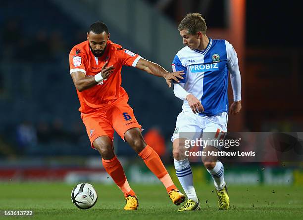 Liam Trotter of Millwall competes with Morten Gamst Pedersen of Blackburn Rovers during the FA Cup sponsored by Budweiser Sixth Round Replay match...