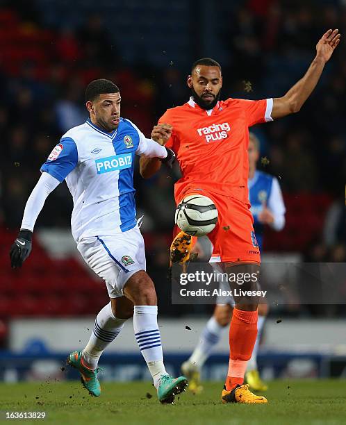 Leon Best of Blackburn Rovers competes with Liam Trotter of Millwall during the FA Cup sponsored by Budweiser Sixth Round Replay match between...