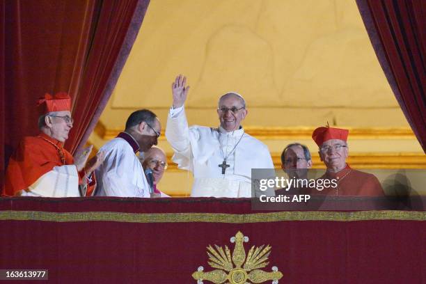 Argentina's Jorge Bergoglio, elected Pope Francis I waves from the window of St Peter's Basilica's balcony after being elected the 266th pope of the...