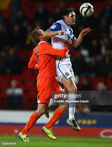 Scott Dann of Blackburn Rovers competes with Rob Hulse of Millwall during the FA Cup sponsored by Budweiser Sixth Round Replay match between...
