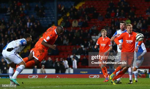 Danny Shittu of Millwall scores the opening goal during the FA Cup sponsored by Budweiser Sixth Round Replay match between Blackburn Rovers and...