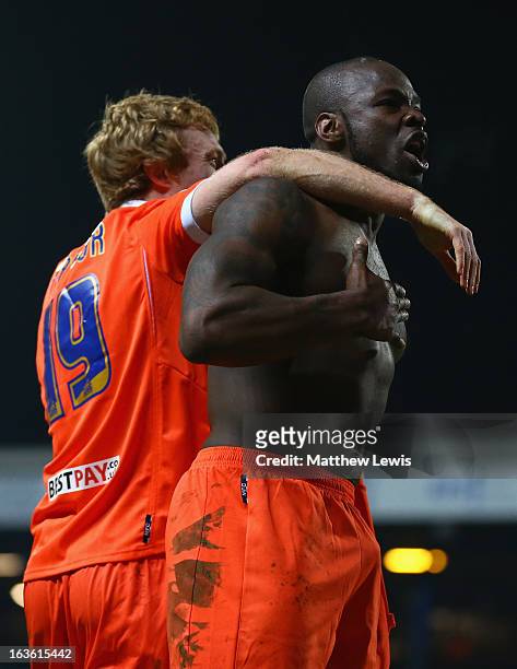 Danny Shittu of Millwall celebrates scoring the opening goal with team-mate Chris Taylor during the FA Cup sponsored by Budweiser Sixth Round Replay...