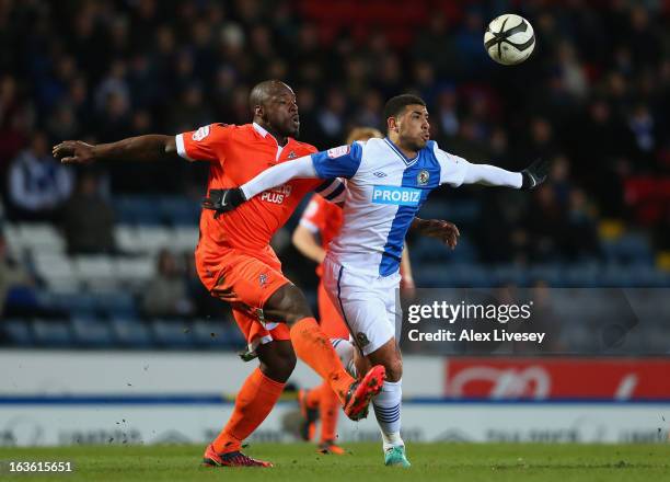 Leon Best of Blackburn Rovers competes with Danny Shittu of Millwall during the FA Cup sponsored by Budweiser Sixth Round Replay match between...