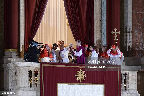 Argentina's cardinal Jorge Bergoglio , elected Pope Francis I prepares to give the benediction to the crowd on the balcony of St Peter's Basilica's...