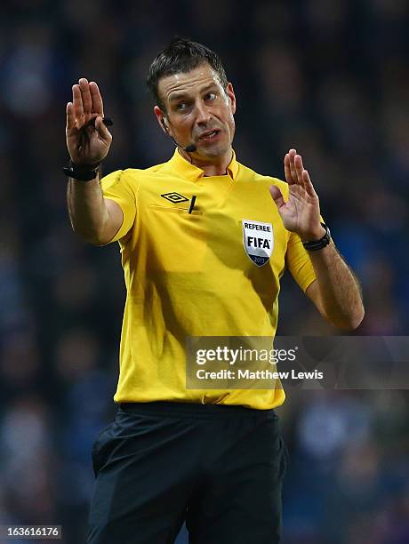 Referee Mark Clattenburg gestures during the FA Cup sponsored by Budweiser Sixth Round Replay match between Blackburn Rovers and Millwall at Ewood...