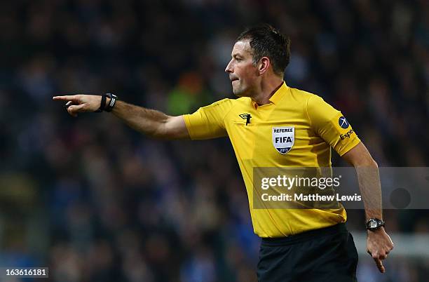 Referee Mark Clattenburg gestures during the FA Cup sponsored by Budweiser Sixth Round Replay match between Blackburn Rovers and Millwall at Ewood...