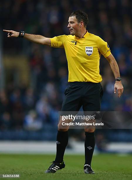 Referee Mark Clattenburg gestures during the FA Cup sponsored by Budweiser Sixth Round Replay match between Blackburn Rovers and Millwall at Ewood...