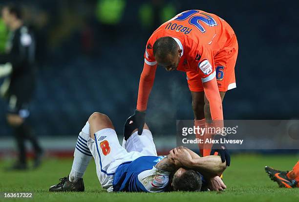David Dunn of Blackburn Rovers is consoled by Nadjim Abdou of Millwall at the end of the FA Cup sponsored by Budweiser Sixth Round Replay match...